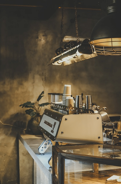 Cafe interior highlighting coffee machine, relevant to legal requirements for buying a cafe in NSW.