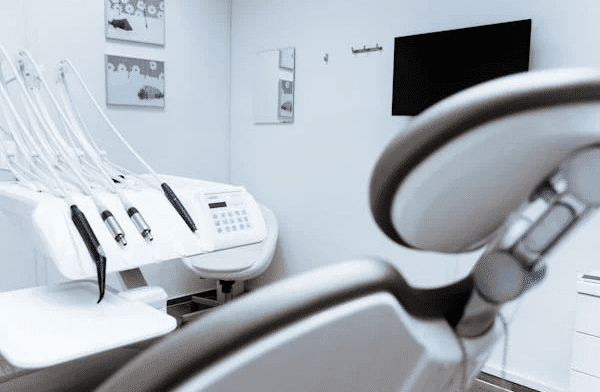 Modern dental examination room, representing the legal requirements for buying a dental practice in NSW.