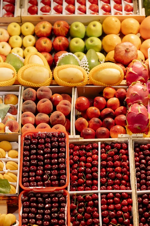 Assorted fruits arranged in a market display, illustrating legal requirements for buying a fruit shop in NSW.